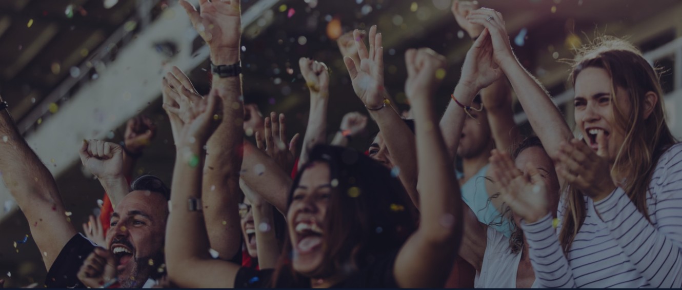 Fans celebrating in a stadium